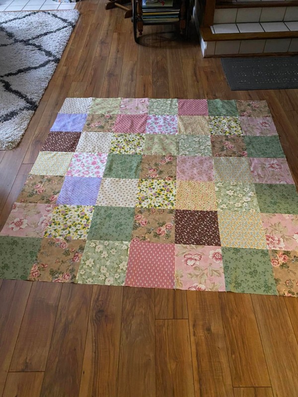 The Back of Laurie W.'s Finished GO! Scrappy Star Log Cabin Quilt
