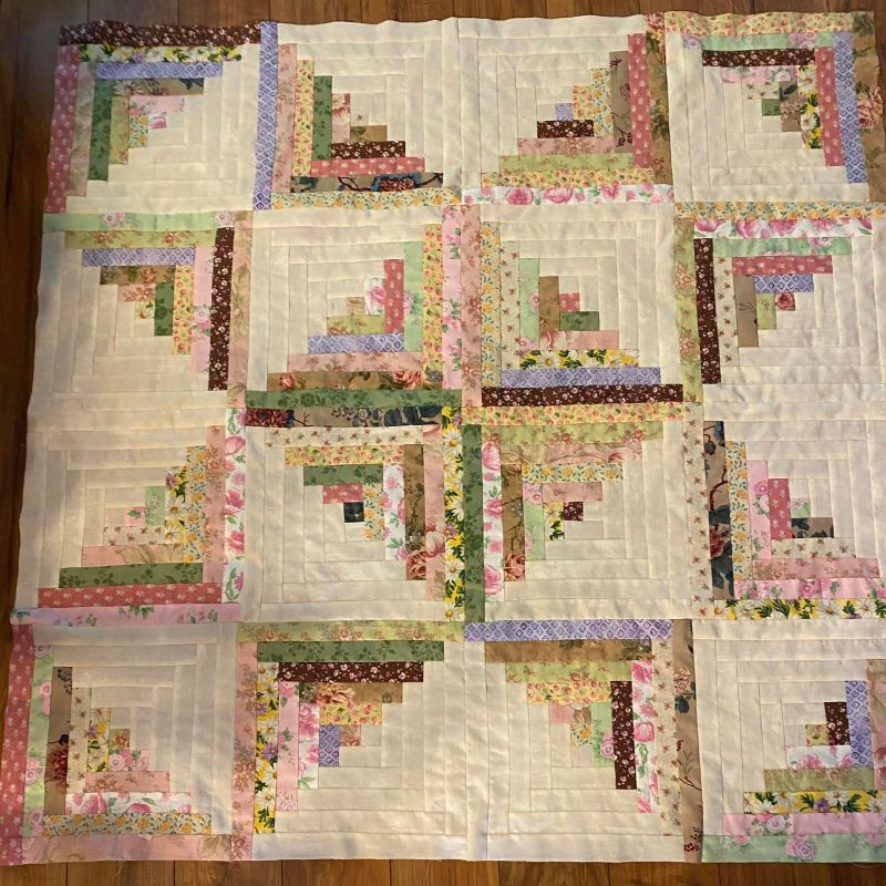 The Front of Laurie W.'s Finished GO! Scrappy Star Log Cabin Quilt